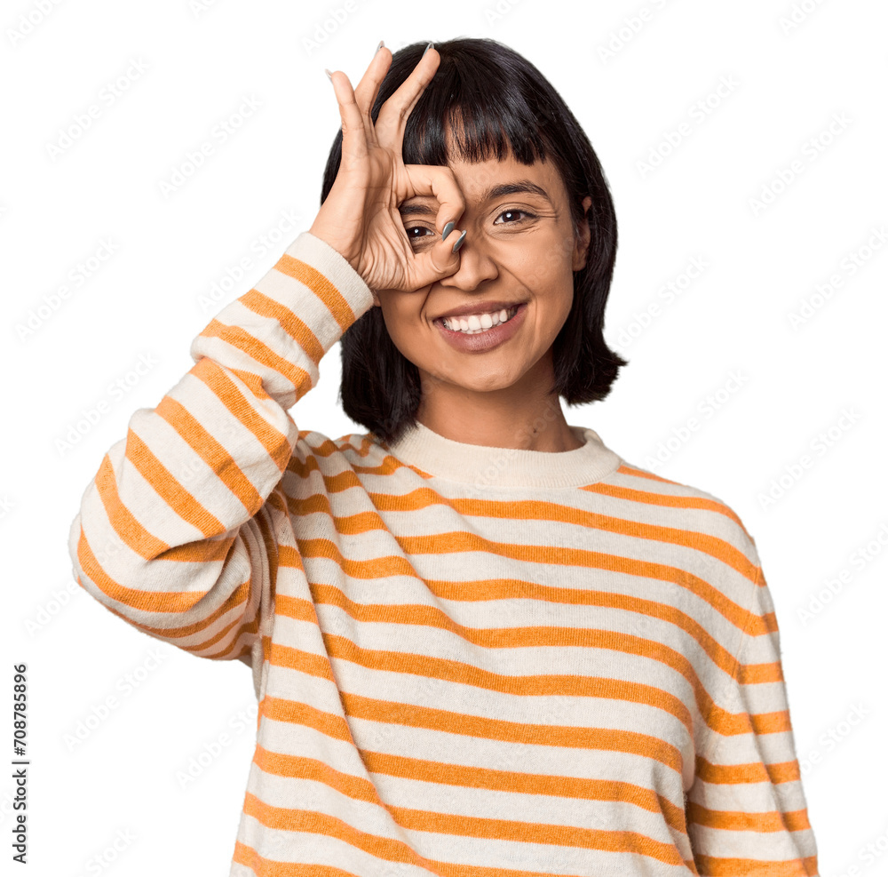 Young Hispanic woman with short black hair in studio excited keeping ok gesture on eye. Young Hispanic woman with short black hair in studio excited keeping ok gesture on eye.