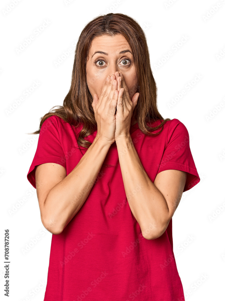 Middle-aged woman portrait in studio setting shocked, covering mouth with hands, anxious to discover something new. Middle-aged woman portrait in studio setting shocked, covering mouth with hands, anxious to discover something new.