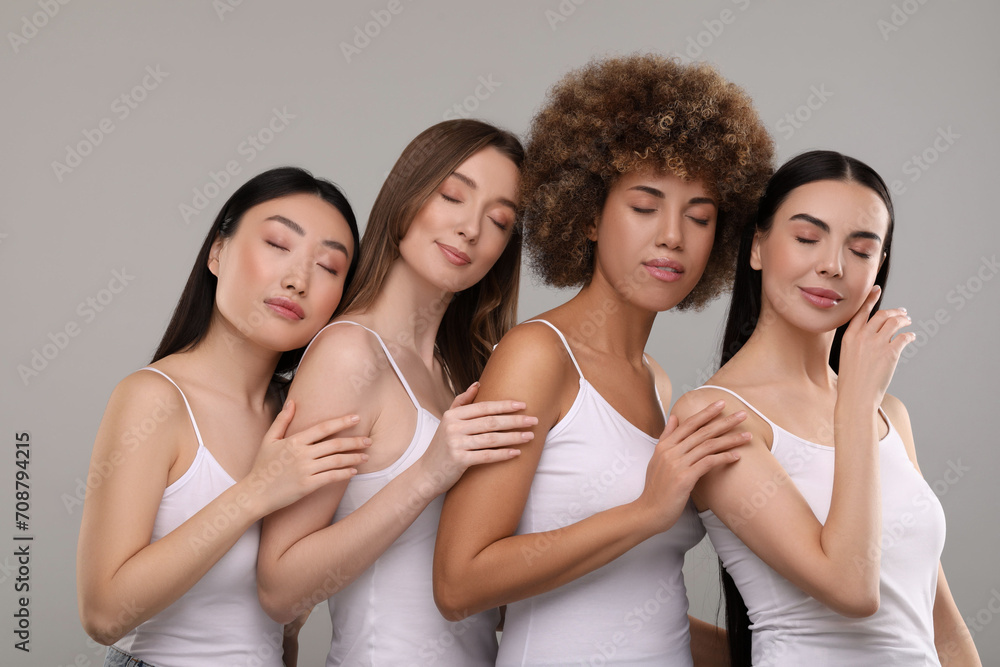Beautiful young women with healthy skin on gray background Beautiful young women with healthy skin on gray background