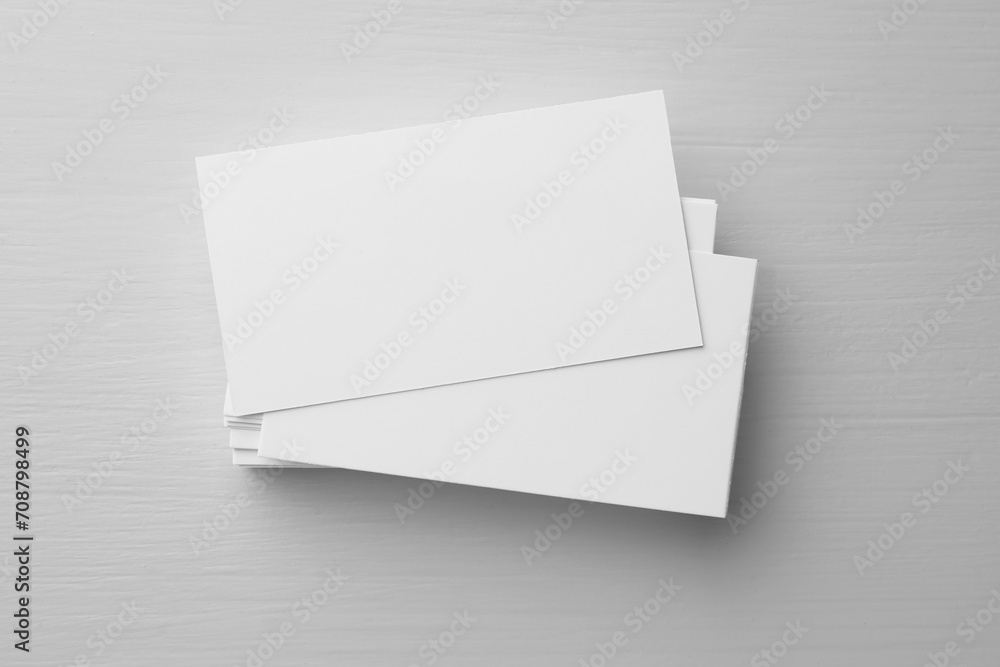 Blank business cards on white table, top view. Mockup for design Blank business cards on white table, top view. Mockup for design
