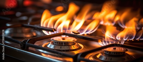 Close-up shot indoors of a natural gas stove's flames.
