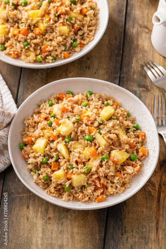 Pineapple fried rice with eggs, carrots and peas