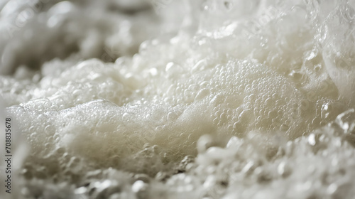 Boiling foam with fine bubbles in close-up view.