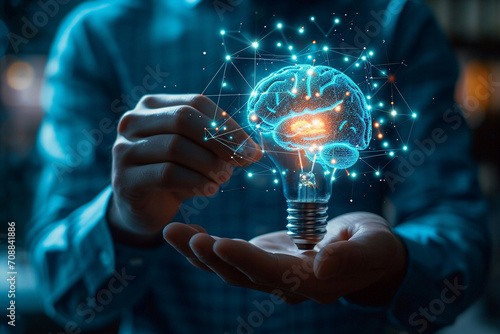 A businessman holds a virtual lightbulb and brain on a blue bokeh background, symbolizing smart thinking, innovation, and inspiration in business.AI generated.