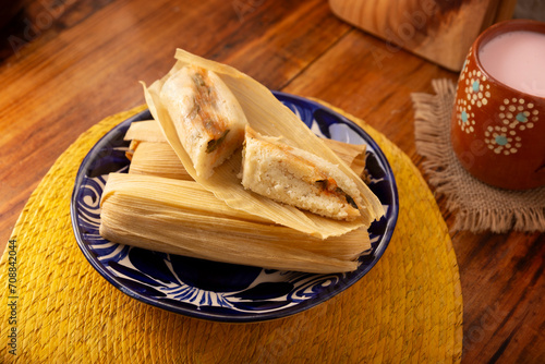 Tamales. hispanic dish typical of Mexico and some Latin American countries. Corn dough wrapped in corn leaves. The tamales are steamed.
