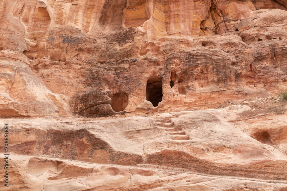 Pagan Nabatean altar carved into the wall at the beginning of the gorge Al Siq in the Nabatean kingdom of Petra in Wadi Musa city in Jordan