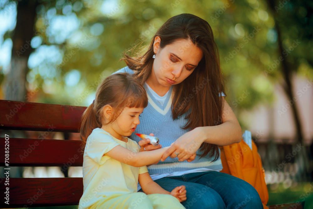 Stressed Mother Applying a Medicinal Cream on the Arm of her Child. Worried mother taking care of her little kid outdoors
Stressed Mother Applying a Medicinal Cream on the Arm of her Child. Worried mother taking care of her little kid outdoors