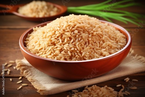 A bowl of brown rice on a wooden table