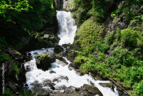 Large cascade of Lyazhgi Waterfall on a summer day