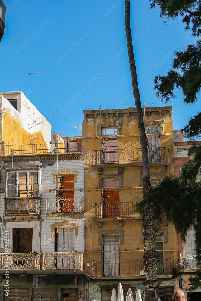 Romantic backstreet, side street and alleys in historic old town of Cartagena, Spain with historic Spanish style architecture facades, a landmark sightseeing tourist spot in downtown Romantic backstreet, side street and alleys in historic old town of Cartagena, Spain with historic Spanish style architecture facades, a landmark sightseeing tourist spot in downtown