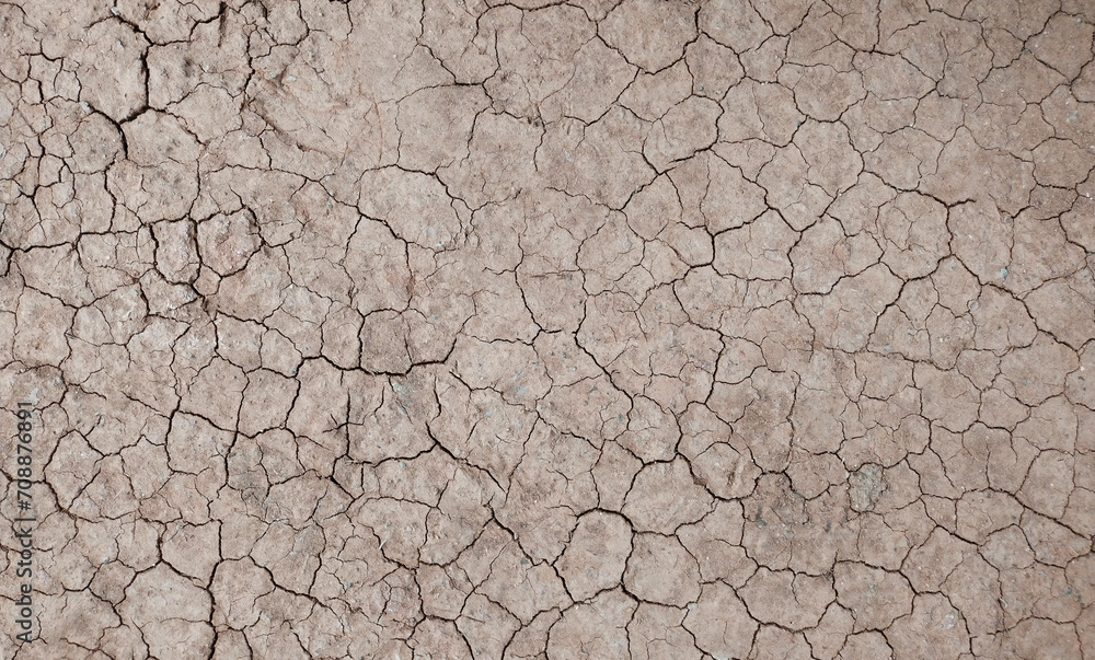 Cracked ground background in the top view for graphic design or wallpaper Cracked ground background in the top view for graphic design or wallpaper