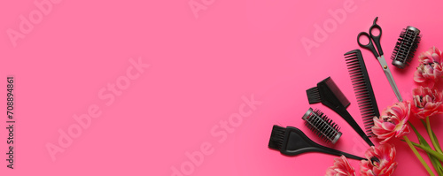 Hairdresser tools and tulip flowers on pink background with space for text © Pixel-Shot