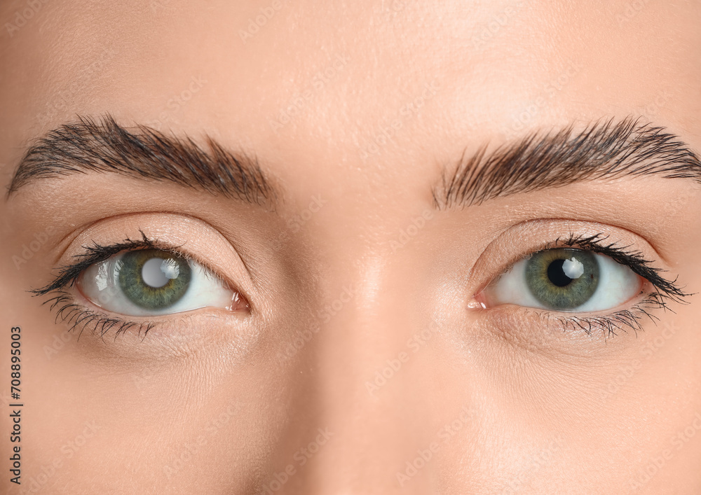 Young woman with green eyes, closeup Young woman with green eyes, closeup