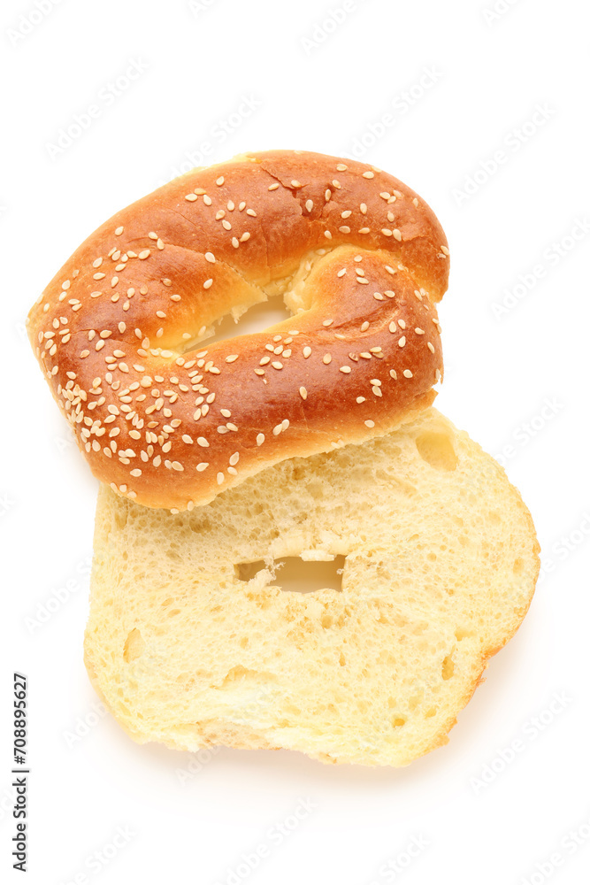 Halves of tasty bagel with sesame seeds on white background Halves of tasty bagel with sesame seeds on white background