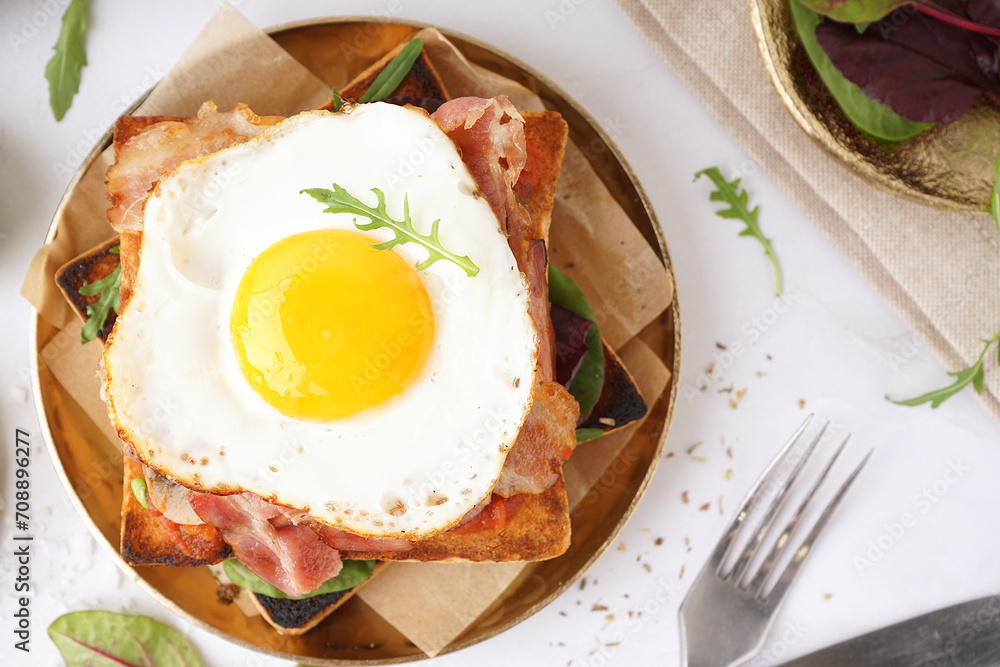 Delicious sandwich with fried egg and bacon on white background Delicious sandwich with fried egg and bacon on white background