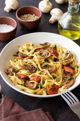 Tagliatelle pasta with mussels and mushrooms. Italian cuisine. Seafood.