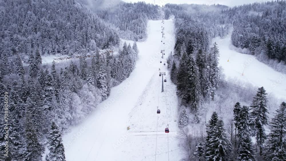 Winter ski resort, ski slope, lift cabins and gondola of aerial view Winter ski resort, ski slope, lift cabins and gondola of aerial view