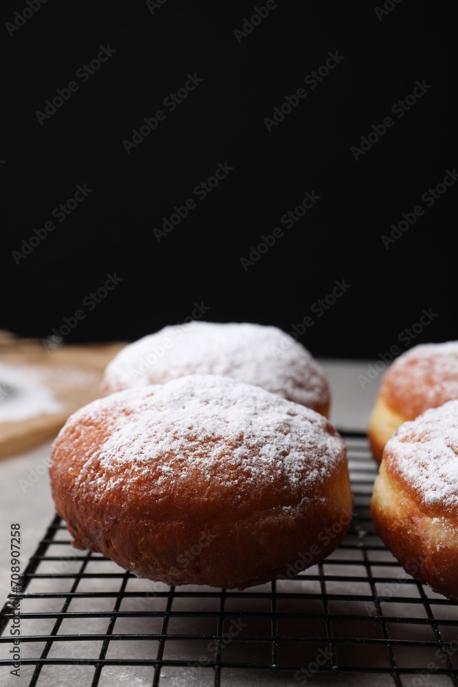Delicious sweet buns on table against black background, space for text Delicious sweet buns on table against black background, space for text