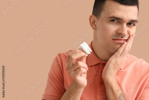 Young man with plastic toot...
