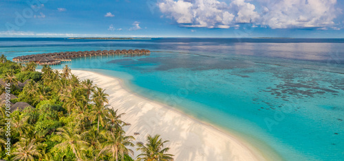 Amazing island beach. Maldives tourism from aerial view tranquil tropical landscape seaside. Stunning palm trees white sandy beach. Exotic nature coast, luxury resort island. Beautiful summer holiday