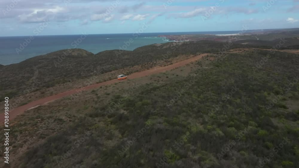Aerial video of a vehicle on the Alentejo coastline of Portugal on a sunny day. Aerial video of a vehicle on the Alentejo coastline of Portugal on a sunny day.