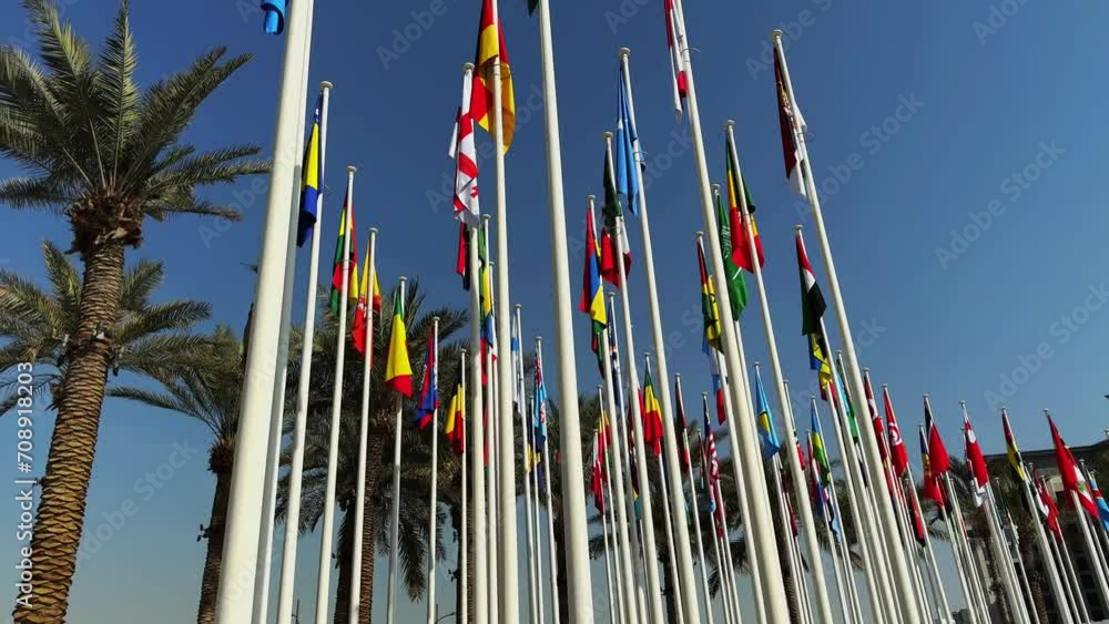Flags of different countries at the background of blue sky. High quality 4k footage Flags of different countries at the background of blue sky. High quality 4k footage