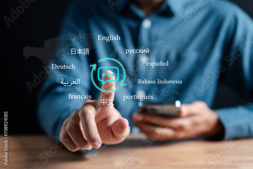 Businessman using  translation or translate on the mobile app worldwide language conversation speaking concept... photo