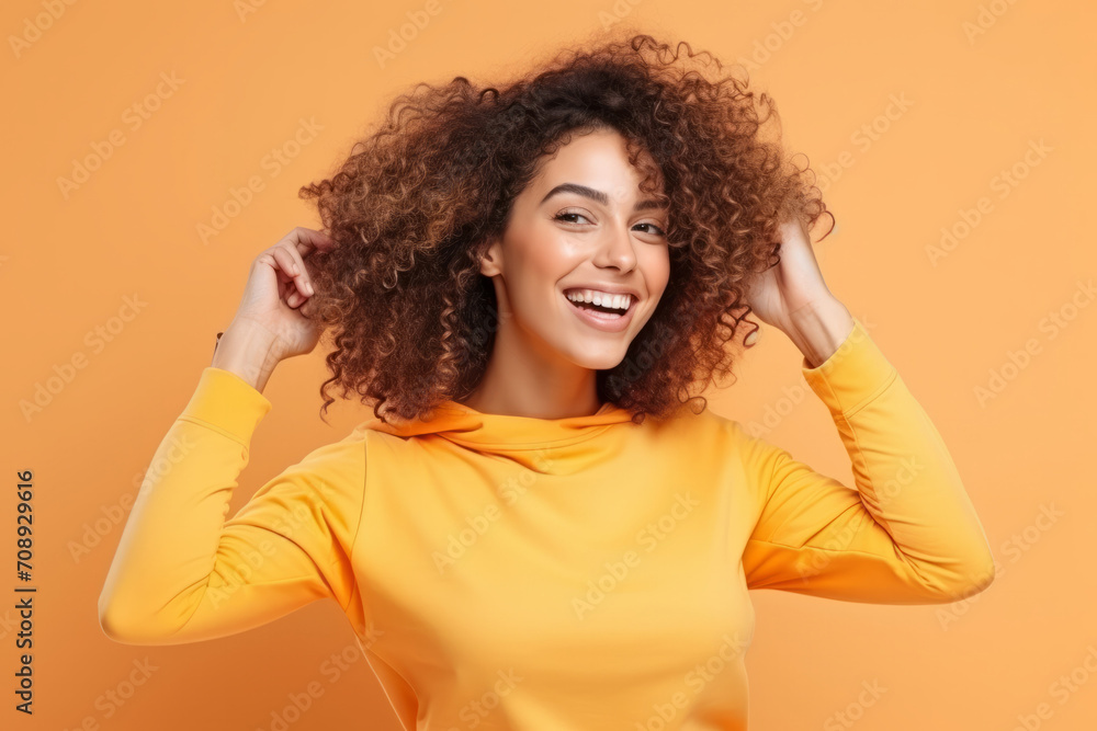 Cheerful young woman in yellow hoodie Cheerful young woman in yellow hoodie