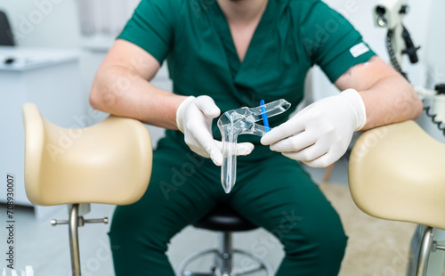 Medical specialist holding equipment. Professional diagnostic treatment.