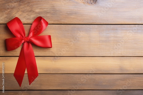 Red ribbon on wooden background, aids awareness . World AIDS day. Healthcare and medical concept.