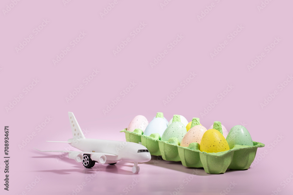 Easter eggs and plane on a pink background, holiday travel concept, avia decorations, spring vacation Easter eggs and plane on a pink background, holiday travel concept, avia decorations, spring vacation