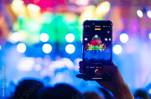 People holding smart phone and recording and photographing in music festival concert, party event background concept