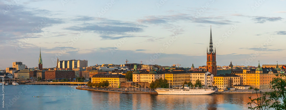 A detailed panoramic shot of the old town of Stockholm in evening sunlight lights in autumn, riddarholmen, old town,kungsholmen and the downtown 