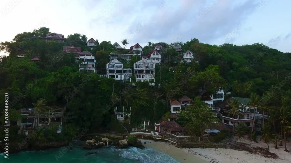 Aerial view of the aftermath of a typhoon in the Philippines, a destroyed oceanfront villa located on a cliff Aerial view of the aftermath of a typhoon in the Philippines, a destroyed oceanfront villa located on a cliff