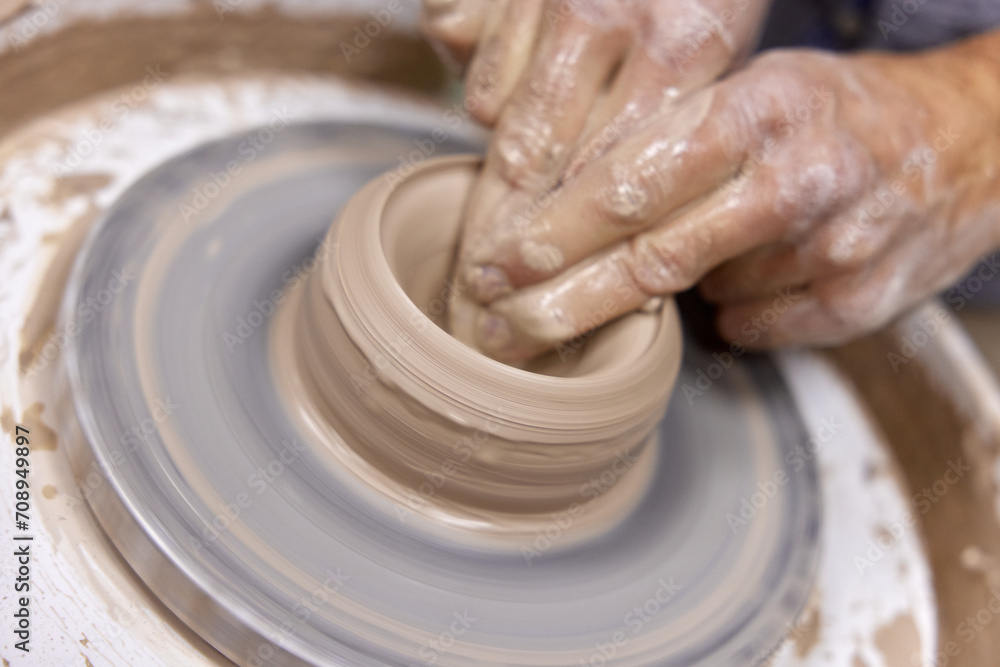 male hands making ceramic cup on pottery wheel, Close-up male hands making ceramic cup on pottery wheel, Close-up