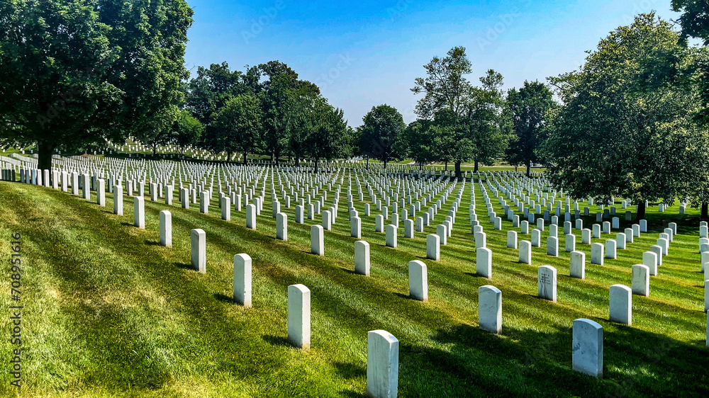 Rows of white marble tombstones at Arlington National Cemetery, the world's most famous military cemetery located in Washington DC, USA.