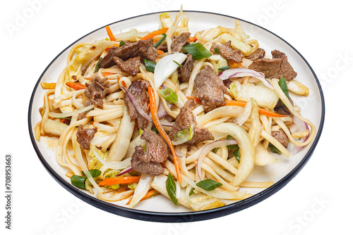 Vietnamese cuisine and food, udon noodles with vegetables and beef on a plate, on a white isolated background