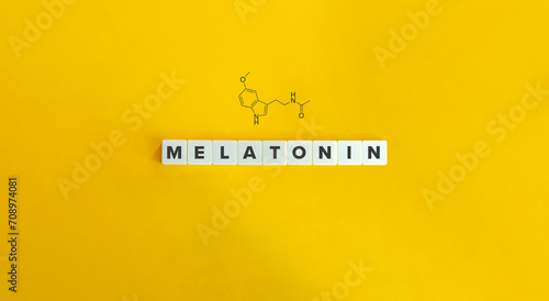 Melatonin Word and 2d Structural Formula. Block Letter Tiles on Yellow Background. Minimalist Aesthetics.