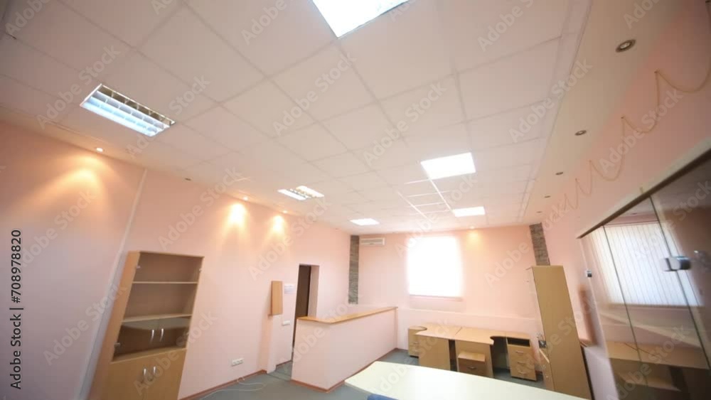Empty tables and cabinets in the waiting room with pink walls Empty tables and cabinets in the waiting room with pink walls