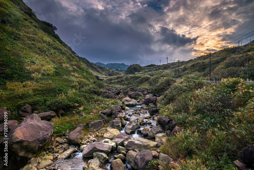 stream with big rock in valley at Taiwan