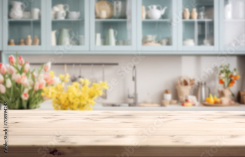 Light empty board against the background of a blurred light spring kitchen with tulips in a Scandinavian style.Ready for product montage.Easter time.Mockup