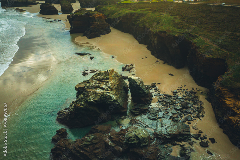 Aerial view of Praia as catedrais, one of the most beautiful beaches in Galicia. The power of water created sea caves and stone arches on this beach (Playa de las Catedrales, Lugo)