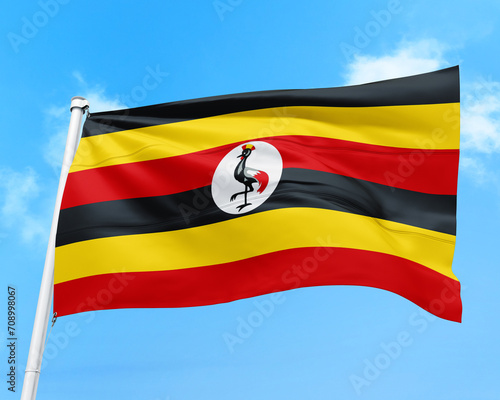 Free Download Uganda flag fluttering in the wind on sky. - GFXLoad
