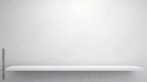 Wallpaper Mural White empty shelf on a light gray wall.A simple white shelf with a soft light illuminating it, perfect for showcasing products or creating a cozy atmosphere in interior design and home decor concepts. Torontodigital.ca