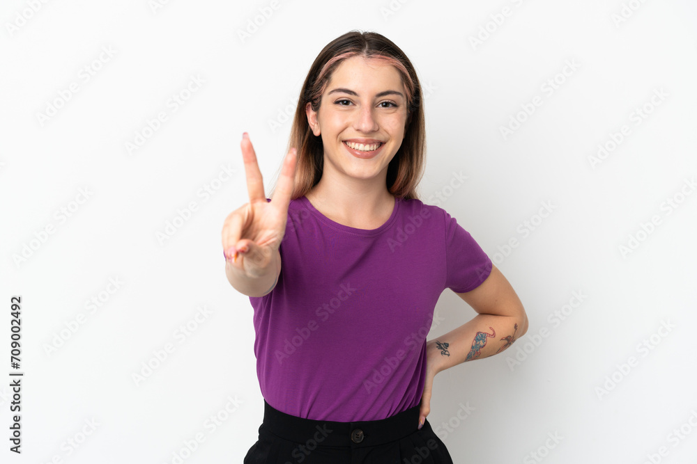 Young caucasian woman isolated on white background smiling and showing victory sign Young caucasian woman isolated on white background smiling and showing victory sign