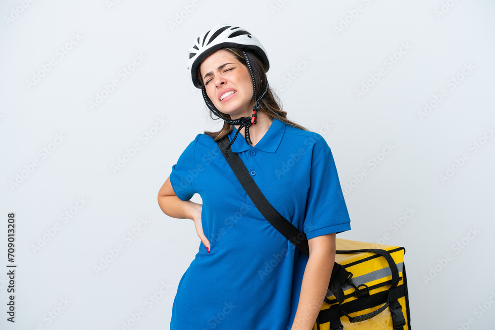 Young delivery woman with thermal backpack isolated on white background suffering from backache for having made an effort Young delivery woman with thermal backpack isolated on white background suffering from backache for having made an effort