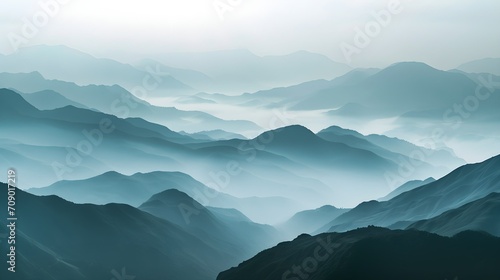 tranquil morning with layers of mountains veiled in mist, showcasing the serene beauty of untouched nature. photo
