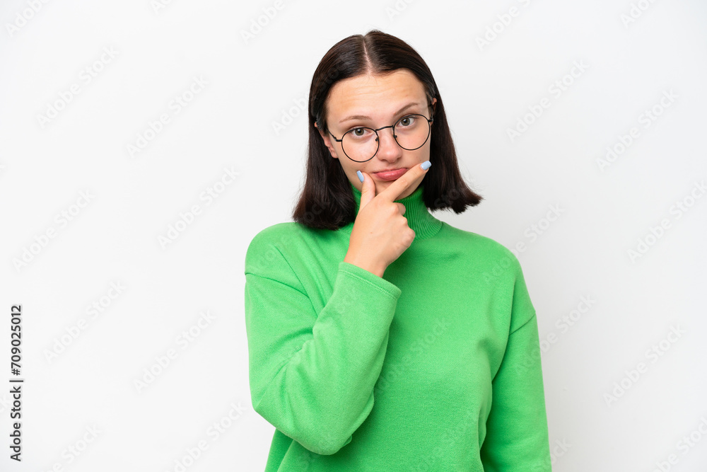 Young caucasian woman isolated on white background having doubts