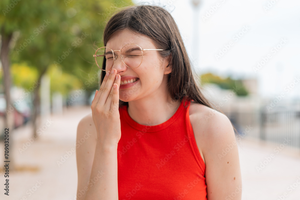 Young woman with glasses at outdoors smiling a lot Young woman with glasses at outdoors smiling a lot