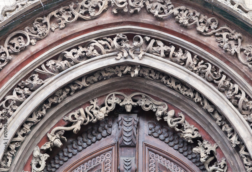 Tympanum of an old door in Prague